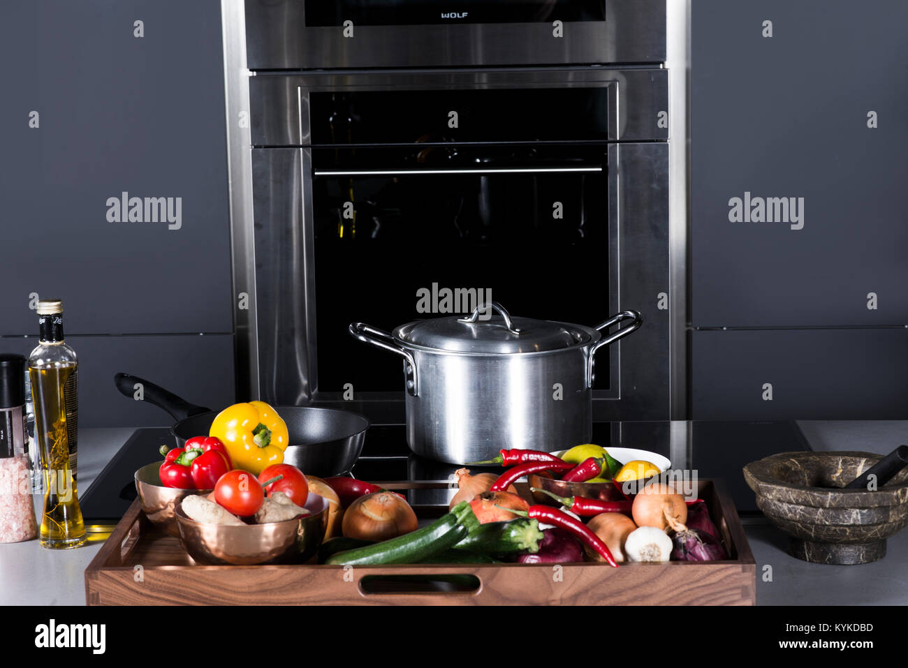 Stainless Steel cooking pan in kitchen with vegetables Stock Photo Alamy