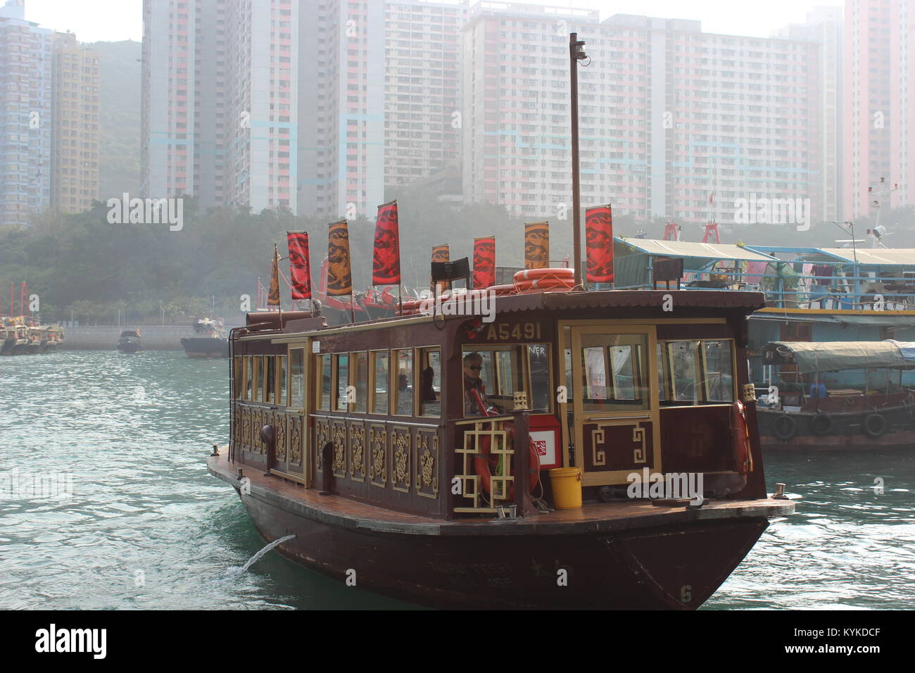 A Traditional Boat Sailing Around Ap Lei Chau Harbour in Hong Kong Stock Photo