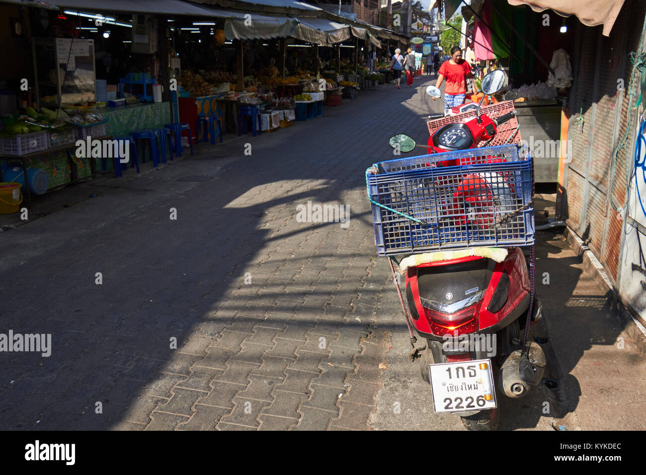 A motorcycle parked on the street, Chinatown, Chiang Mai, Thailand Stock Photo