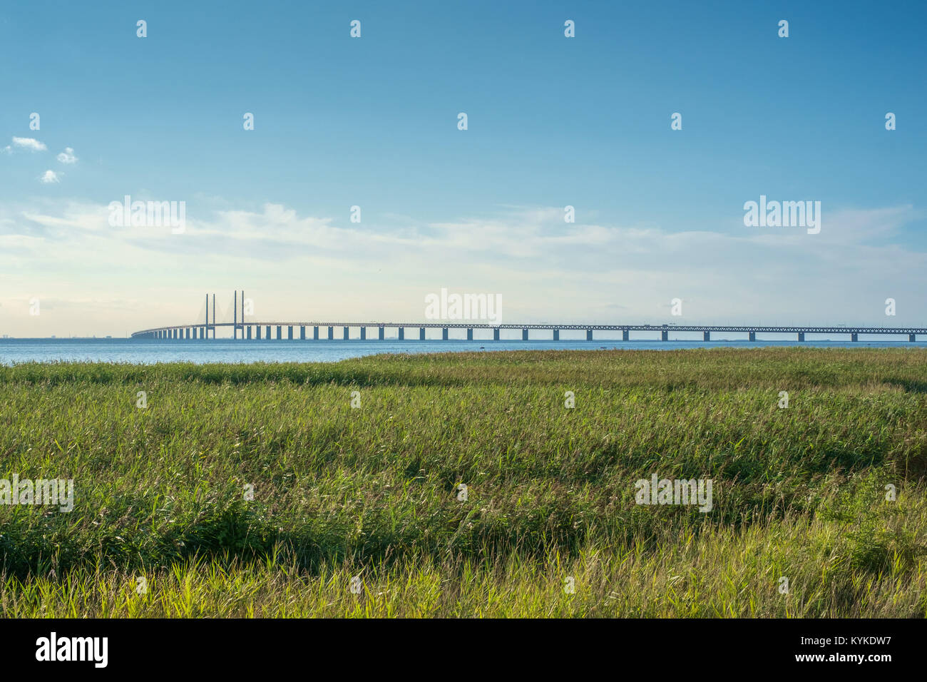 Oresund and Oresund Bridge viewed from Bunkeflostrand in Malmo, Sweden on a sunny summer day. Stock Photo