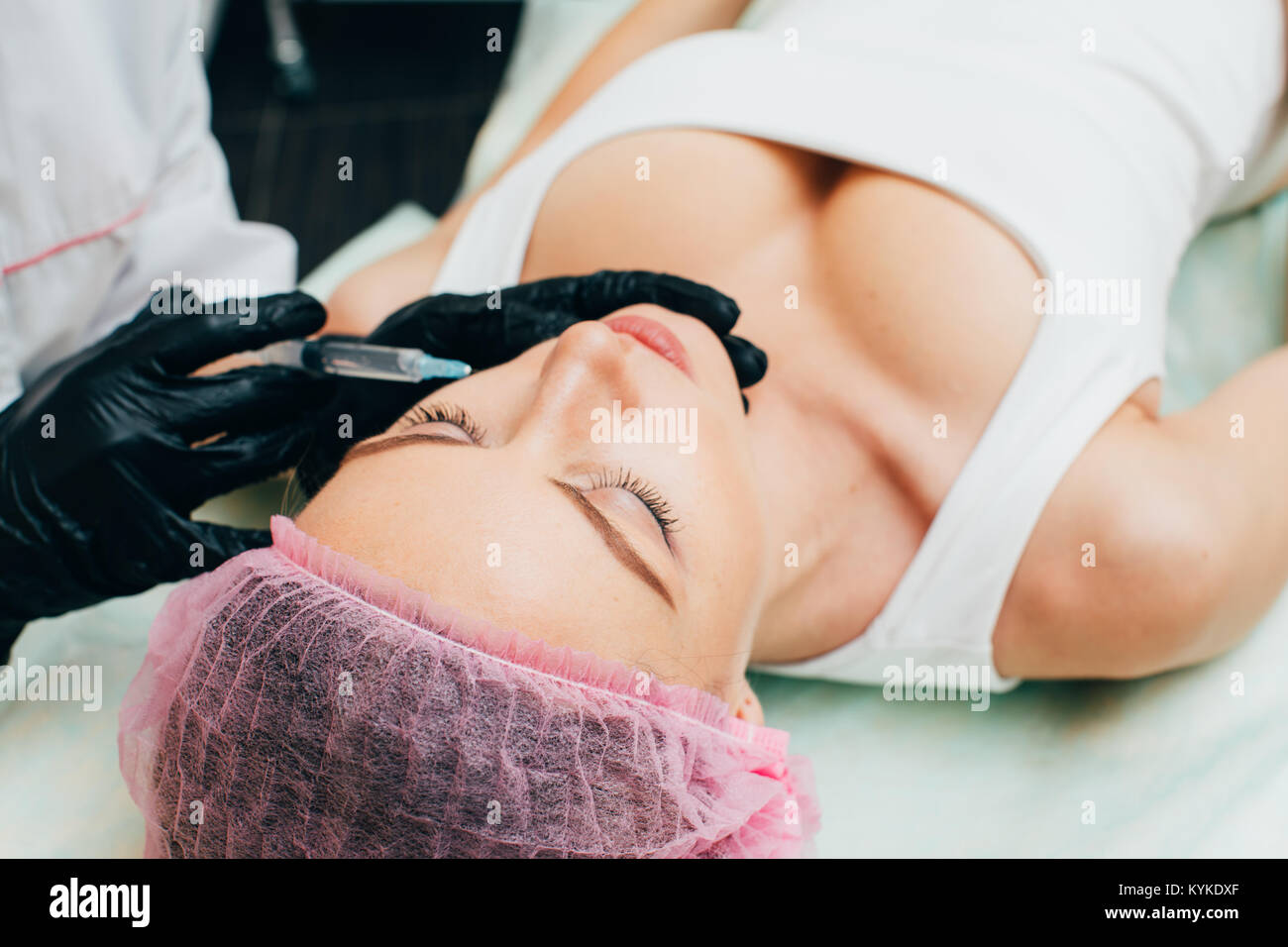 Cosmetic Treatment. Closeup Beautician Hands Doing Facial Skin Lifting Injection To Woman's Face. Female With Closed Eyes Receiving Beauty. Biorevital Stock Photo