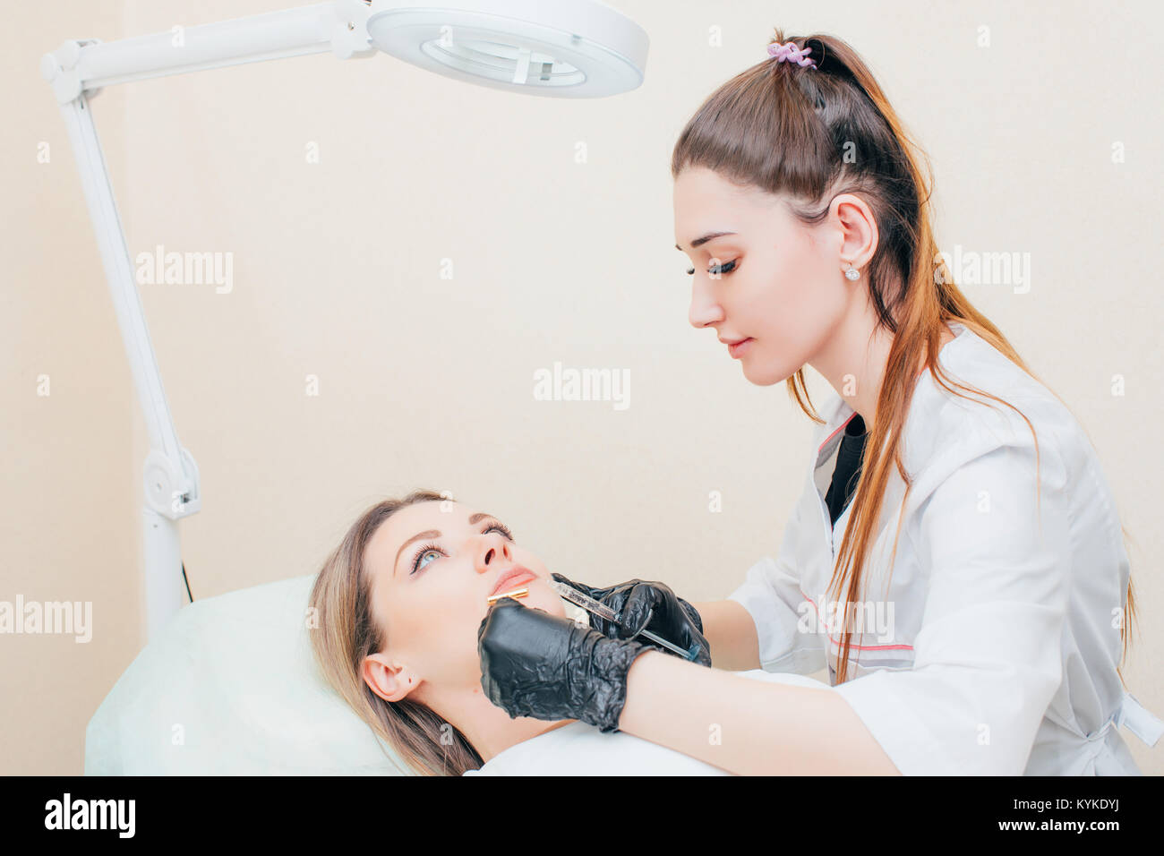 Syringe with filler for face contouring or augmentation. Model, point of view. Cosmetological clinic. Healthcare, cosmetology, clinic Stock Photo