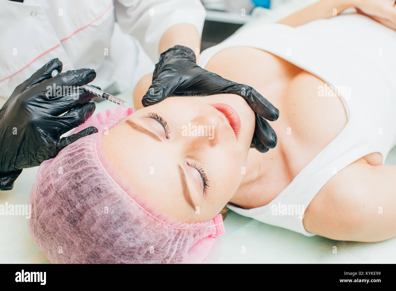 Cosmetic Treatment. Closeup Beautician Hands Doing Facial Skin Lifting Injection To Woman's Face. Receiving Beauty Procedure Indoors. High Resolution Stock Photo