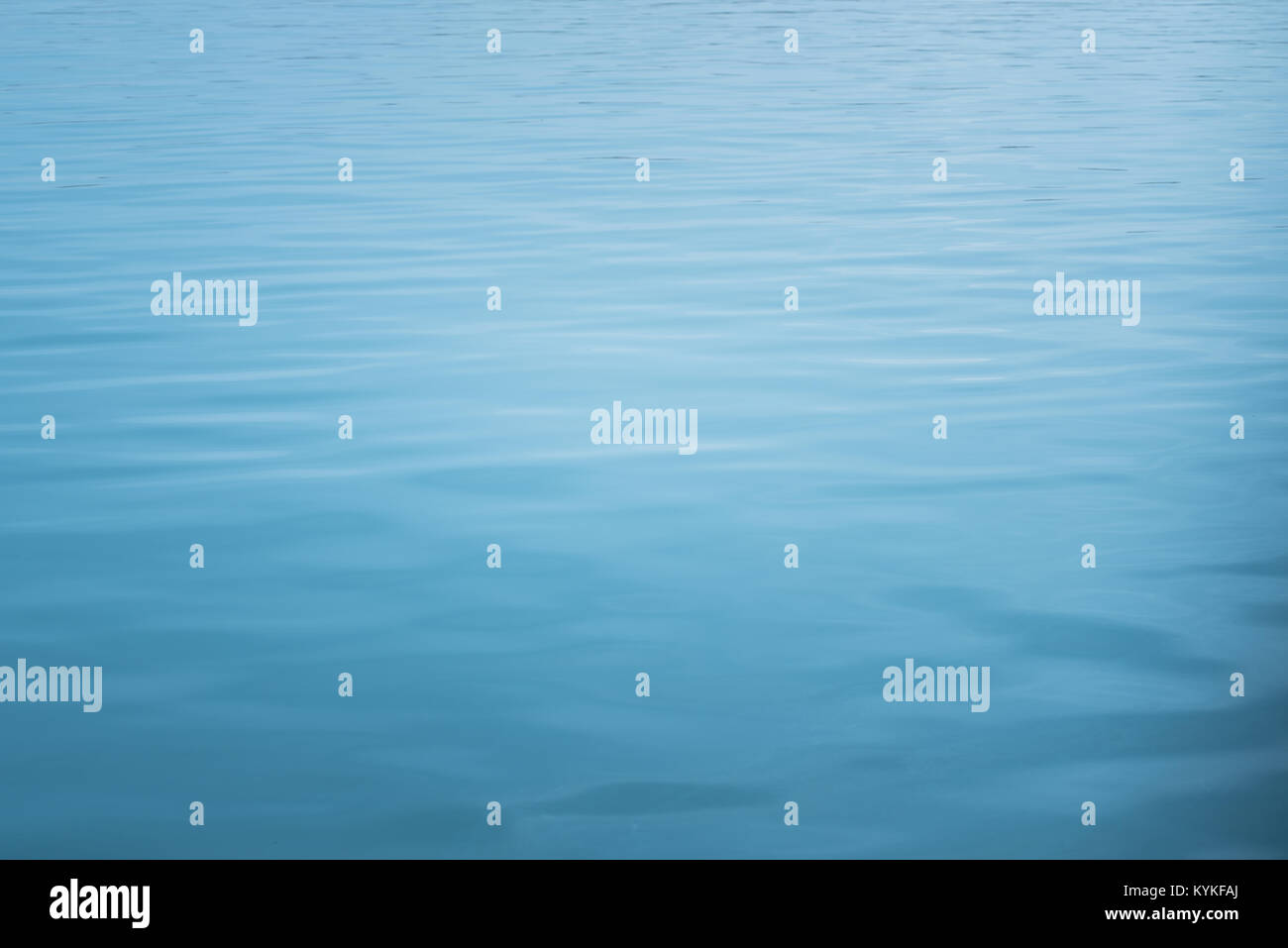 blue sea with waves and calm ocean water surface with small ripples ...