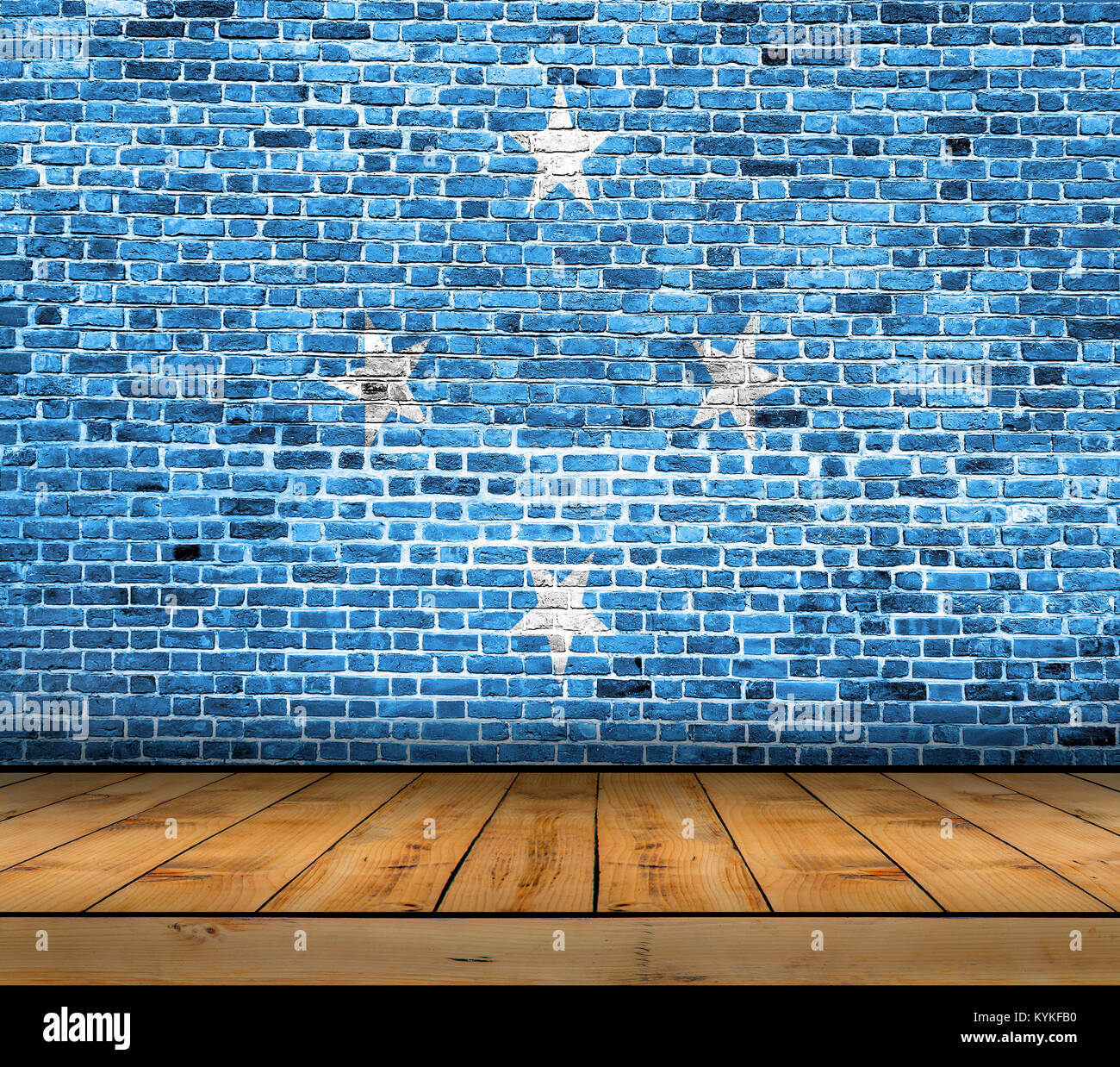 Federated States of Micronesia flag painted on brick wall with wooden floor Stock Photo