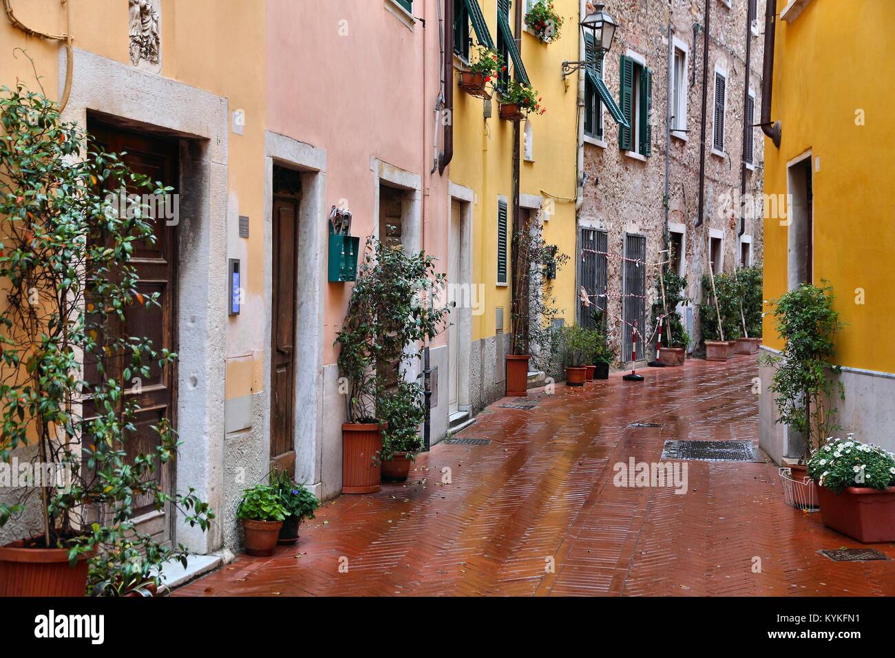 Carrara, Italy - Old Town in the region of Tuscany. Rainy street view. Stock Photo