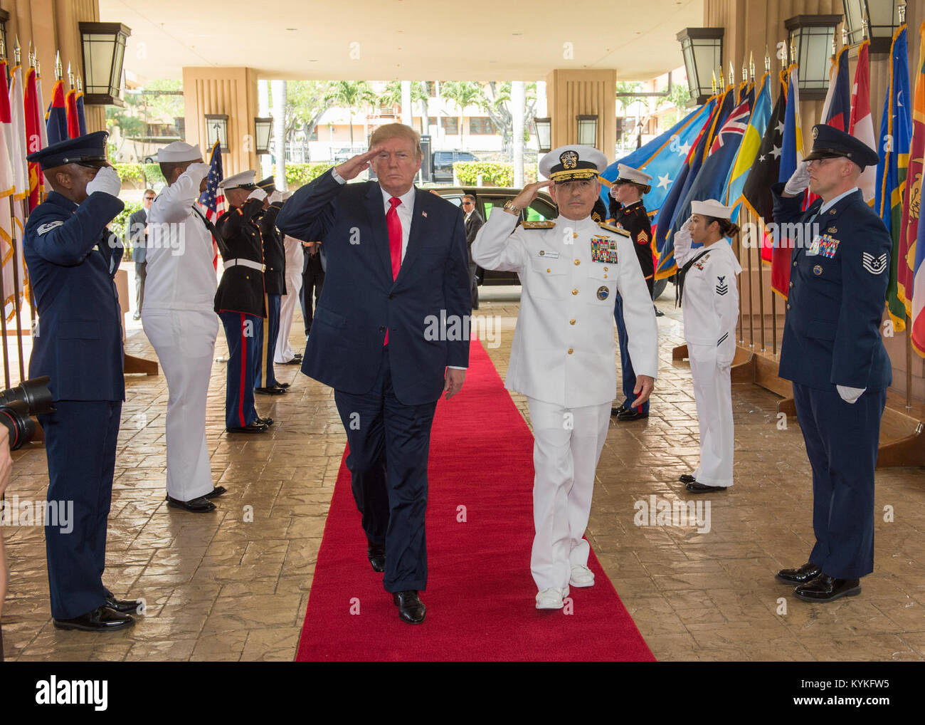 171103-N-WY954-037  CAMP H.M. SMITH, Hawaii (Nov. 3, 2017) President Donald J. Trump and U.S. Pacific Command (USPACOM) Commander, Adm. Harry Harris, are piped aboard during an honors ceremony at USPACOM headquarters.  The President is in Hawaii to receive a briefing from USPACOM prior to traveling to Japan, the Republic of Korea, China, Vietnam and the Philippines from November 3-14. During the trip the President will underscore his commitment to longstanding U.S. alliances and partnerships, and reaffirm U.S. leadership in promoting a free and open Indo-Asia-Pacific region. (U.S. Navy photo b Stock Photo
