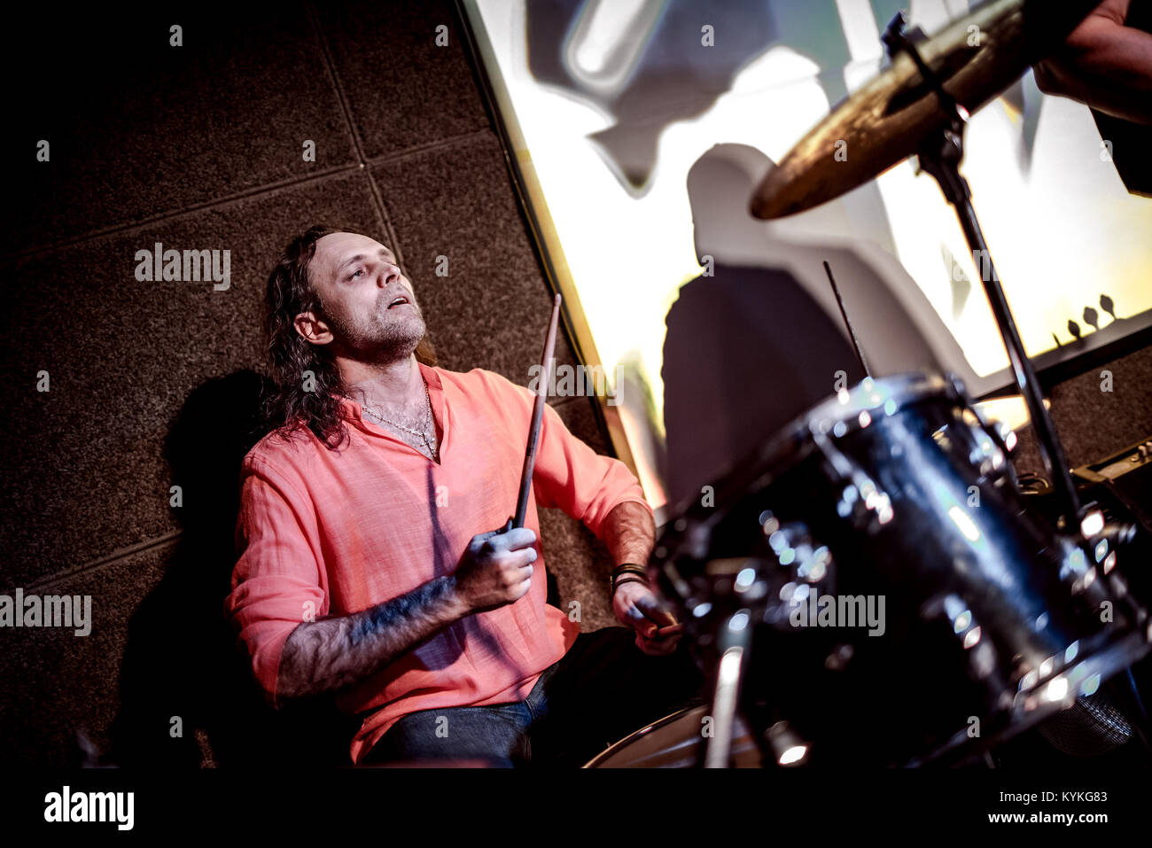 Musician playing drums on stage Stock Photo - Alamy