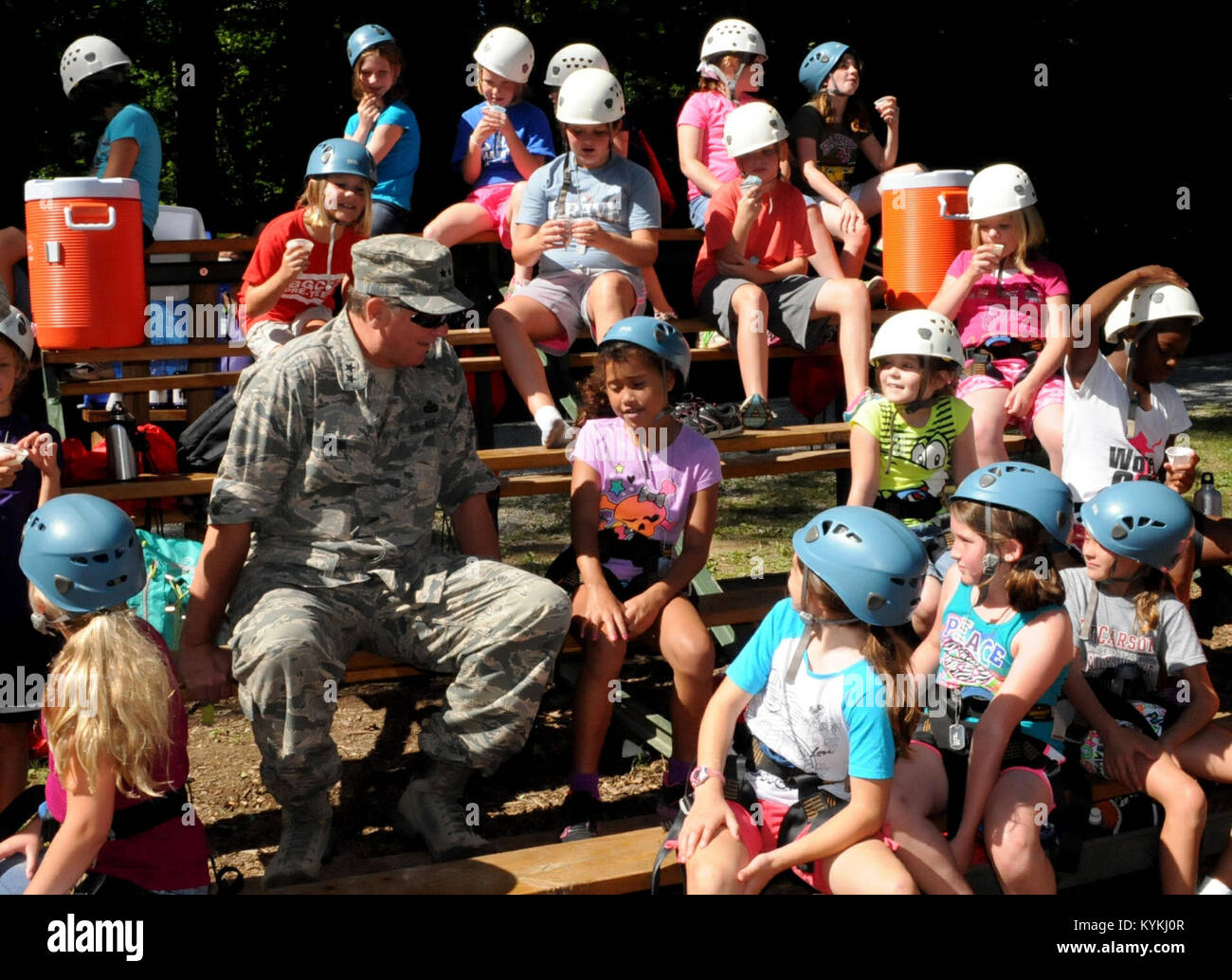 Kentucky's Adj. Gen., Maj. Gen. Edward Tonini, interacts with some of the female participants of the  Kentucky National Guard 4-H Youth Camp July 15 at Lake Cumberland, Ky. The girls were preparing to climb a rock wall. (U.S. Army National Guard photo by Spc. Brandy Mort) Stock Photo