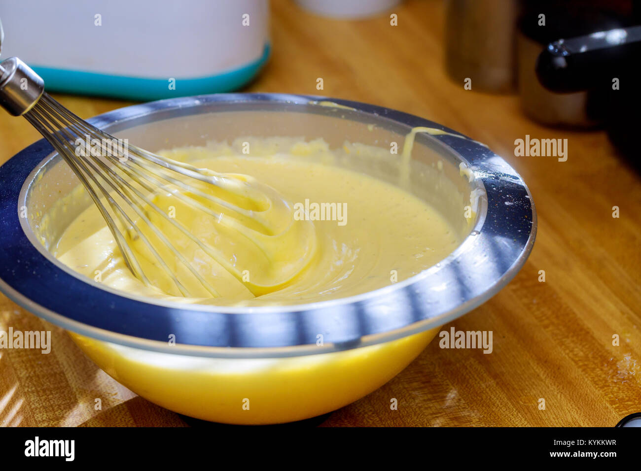 close up of twist white cream spiining in the blow mixing cream with mixer Stock Photo