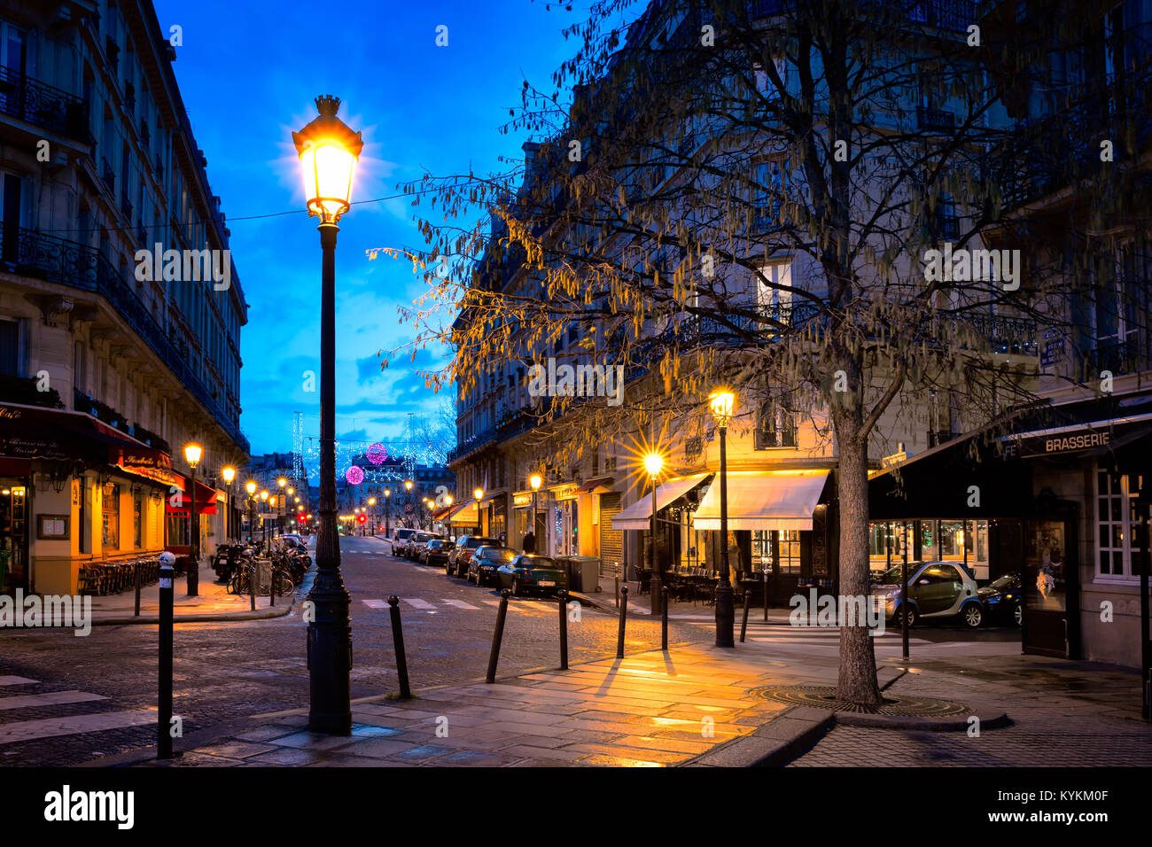 PARIS-JAN 5, 2014: Paris street decorated for the Christmas holiday in one of the oldest neighborhoods in the city, on the island Ile Saint-Louis. Stock Photo