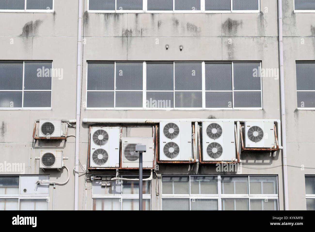Air conditioners on the wall, Many compressor airs are hanging on a ...