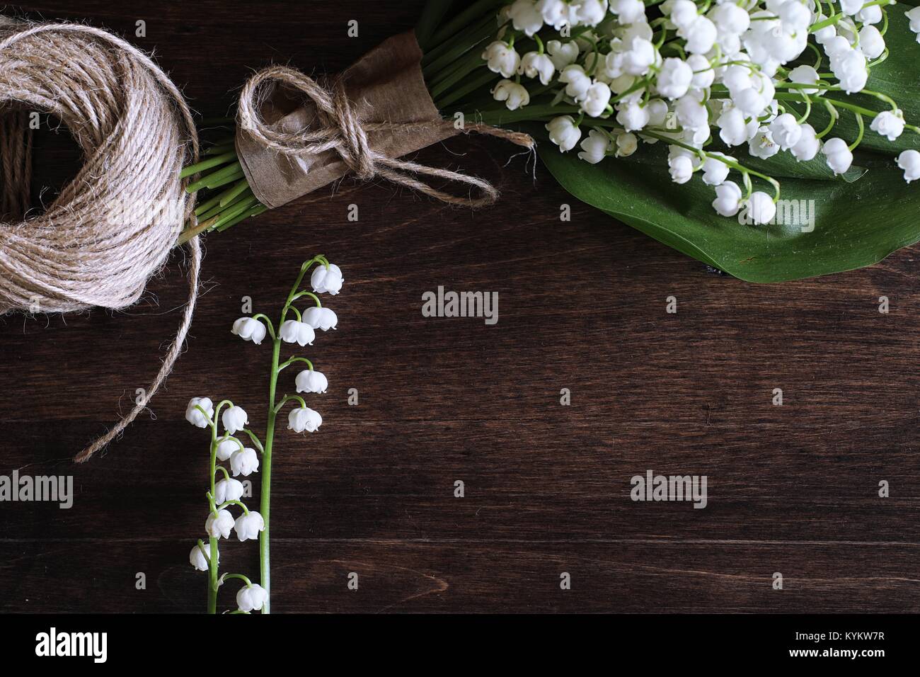 Bouquet of lilies of the valley on a table Stock Photo - Alamy