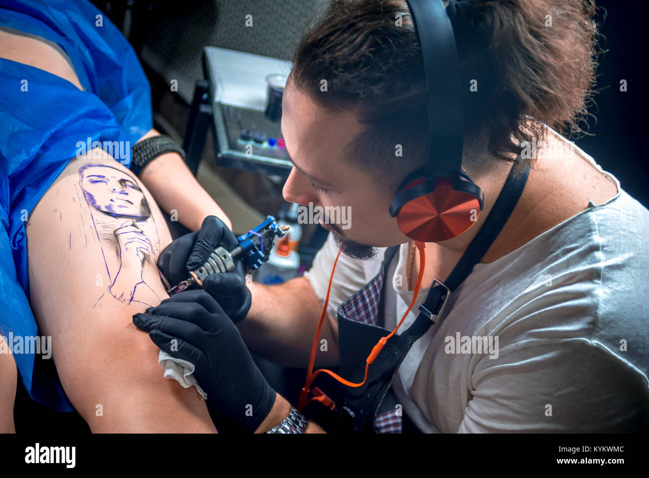 Tattoo artist making tattoo art in a studio Stock Photo Alamy