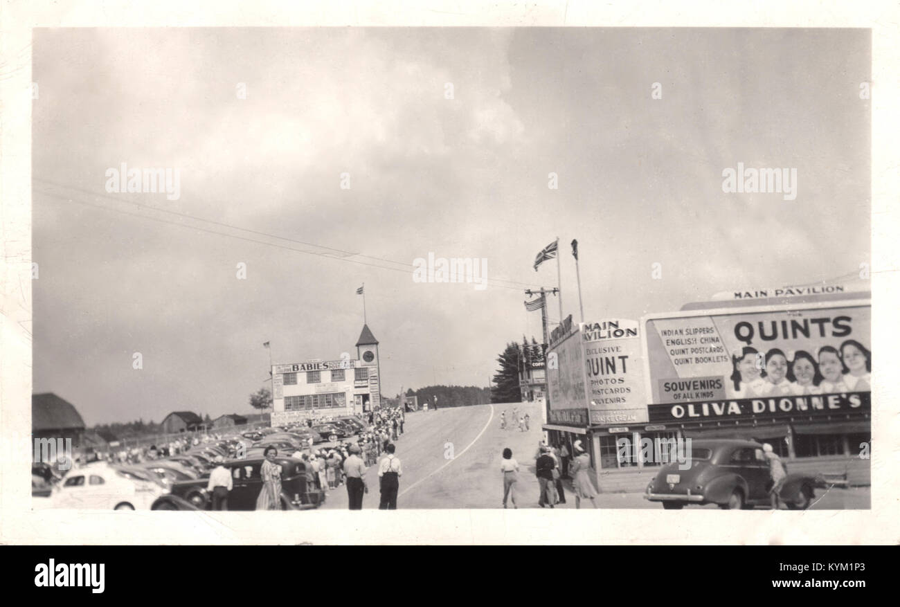 Photograph of the Lessard family viewing the Dionne Quintuplets in ...