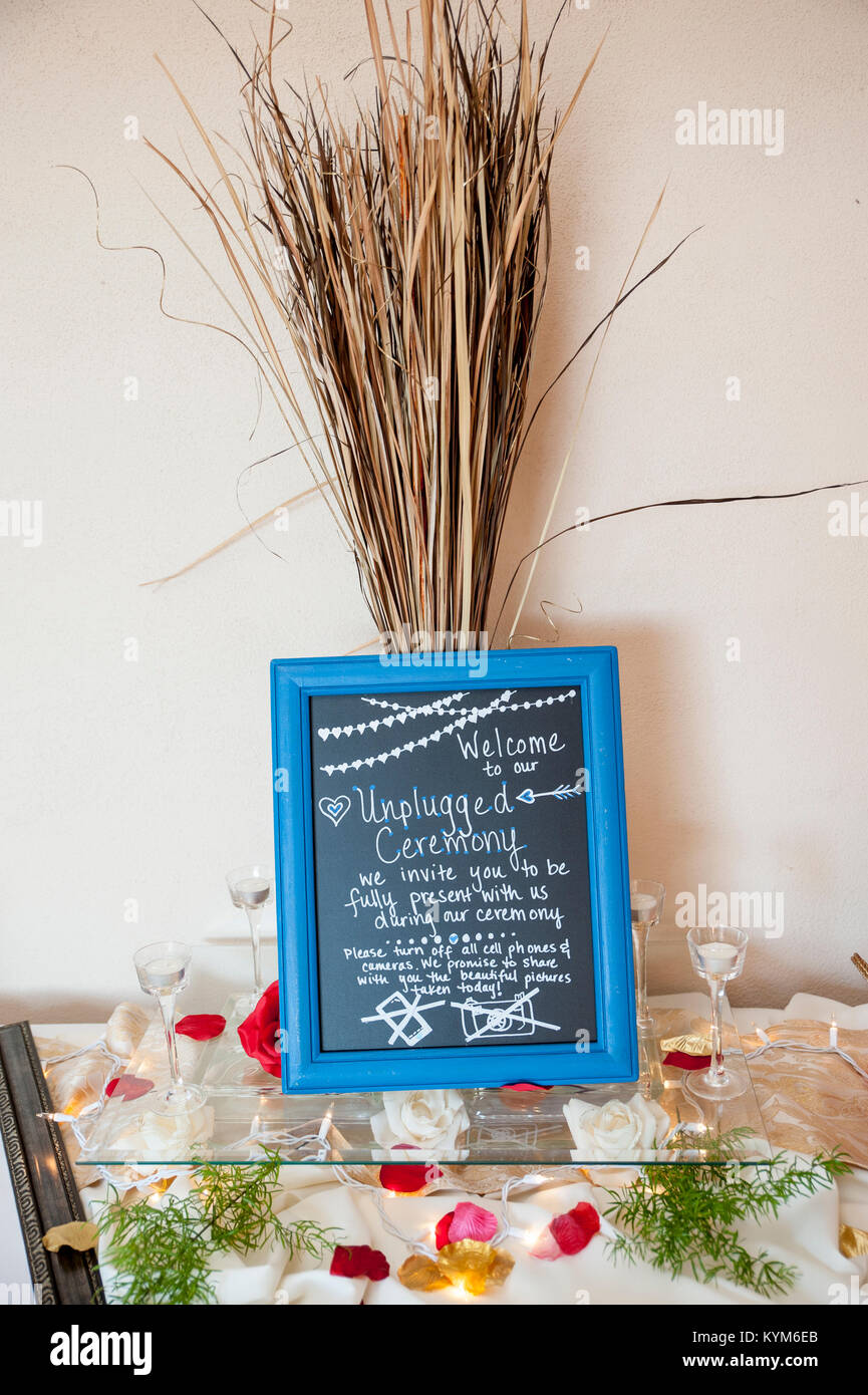 A homemade sign at a wedding asking to be "unplugged" Stock Photo