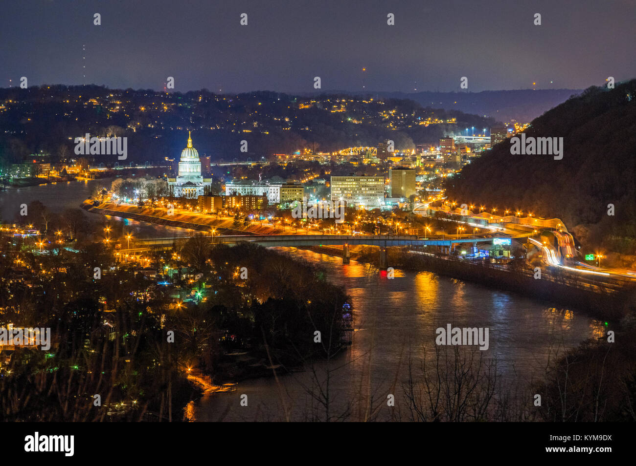 City lights reflect off the Kanawha River at night leading to the Capitol Building of Charleston, West Virginia. Stock Photo
