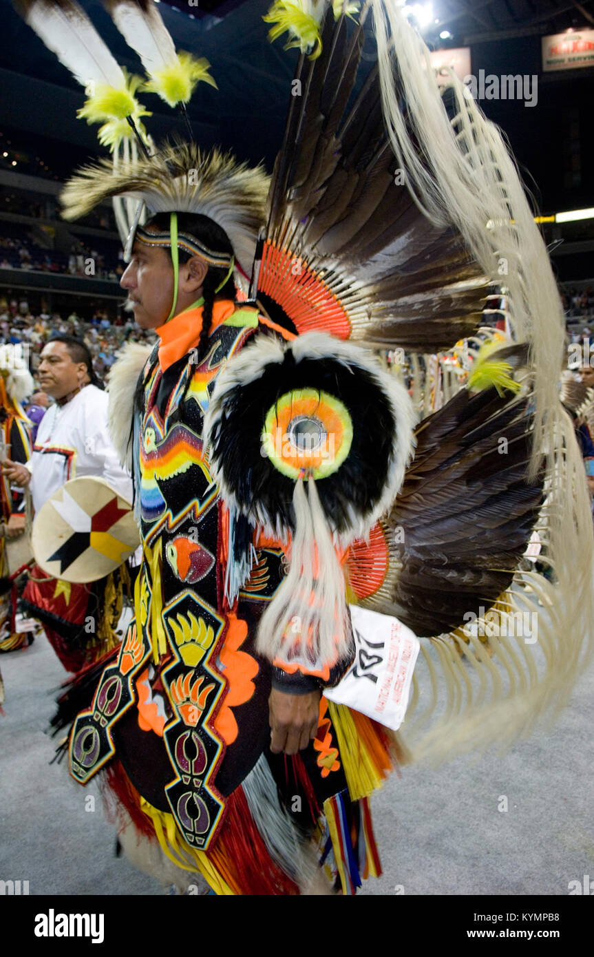 A Native American contestant performing in a powwow competition in 2005 ...