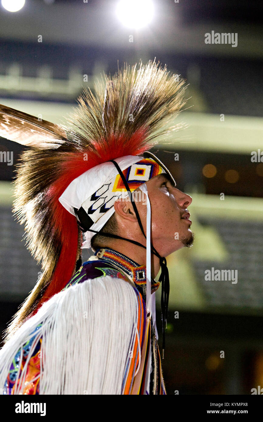 A photograph of a participant in ceremonial dress at a Native American ...