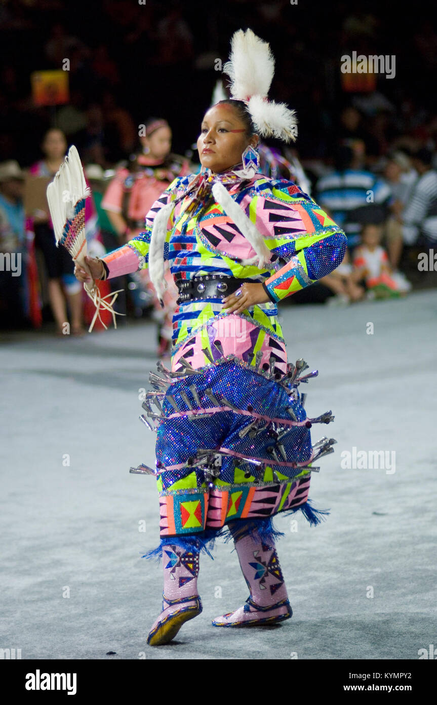 This image captures a Native American dancer in traditional powwow ...