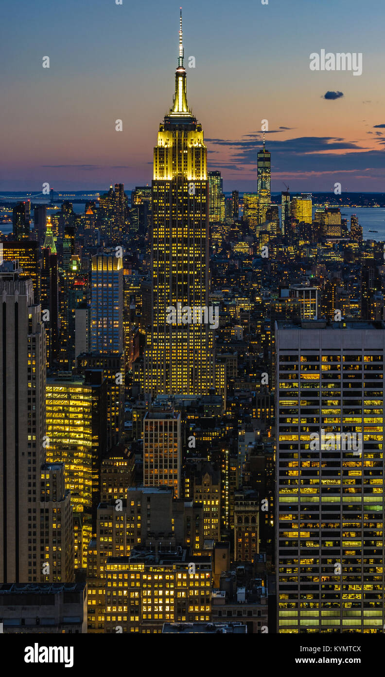 View of the city skyline and the Empire State Building at night from ...