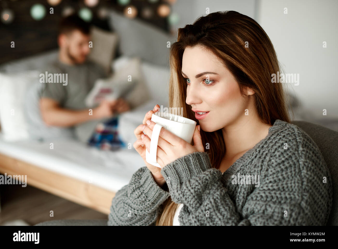 Woman with coffee starting her day Stock Photo