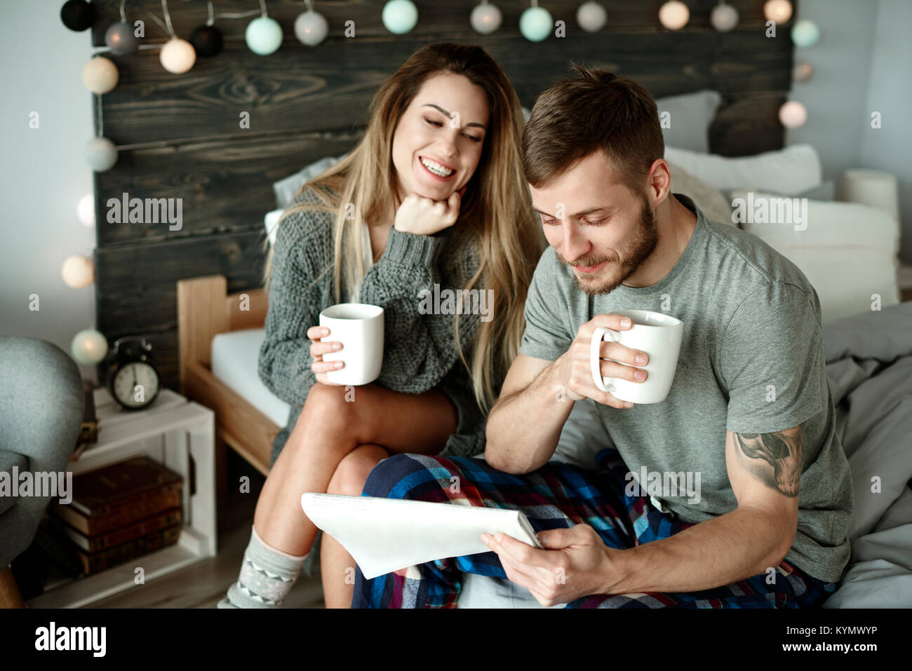 Couple with morning coffee and newspaper Stock Photo