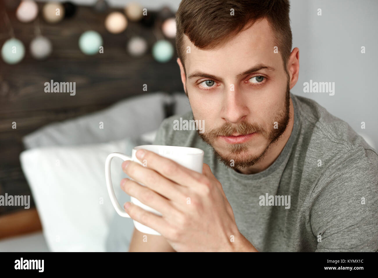 Thoughtful man drinking morning coffee Stock Photo
