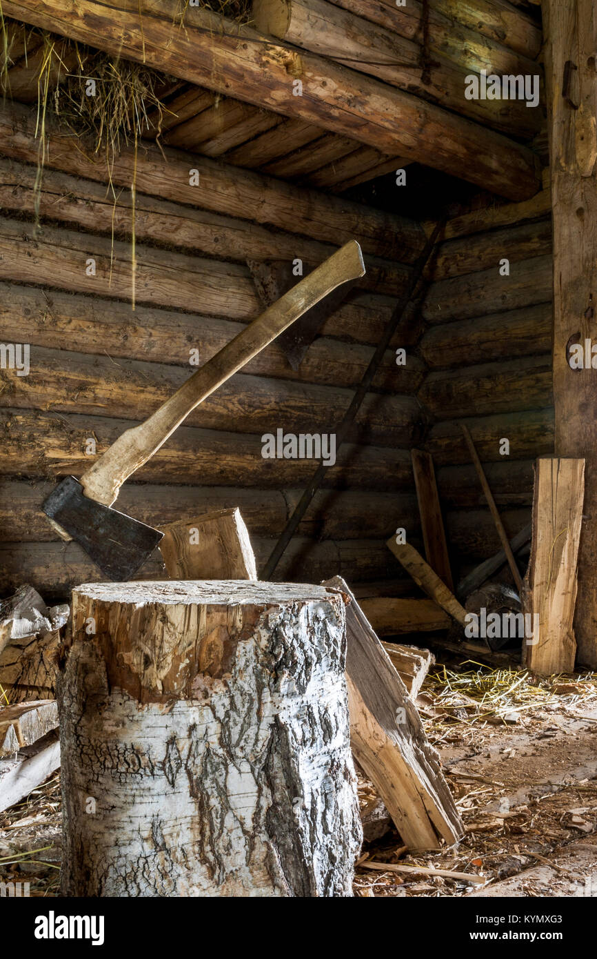 Axe splitter stuck in birch log in village wooden yard Stock Photo Alamy