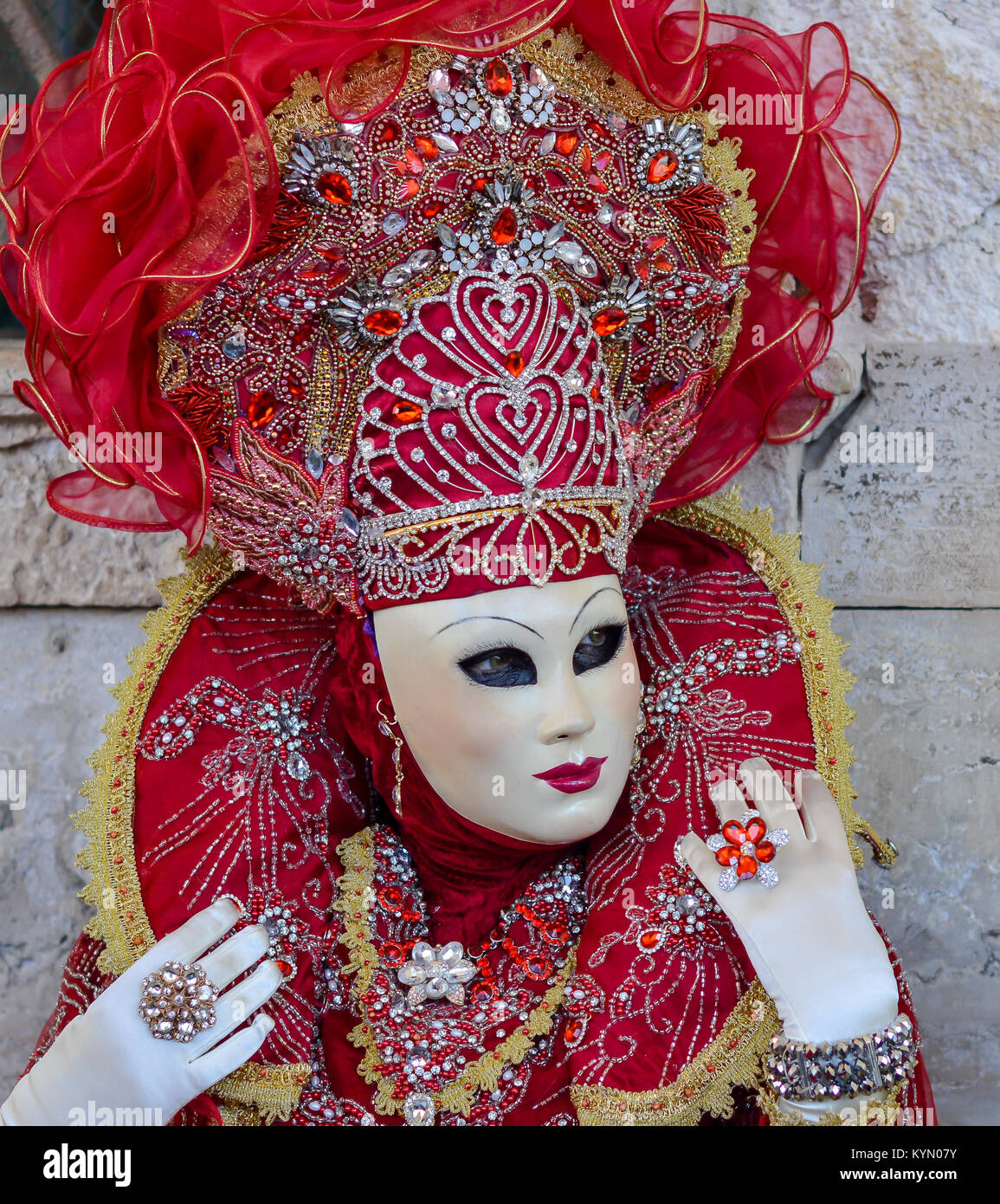 Beautiful red mask and costume at the Venice carnival Stock Photo - Alamy