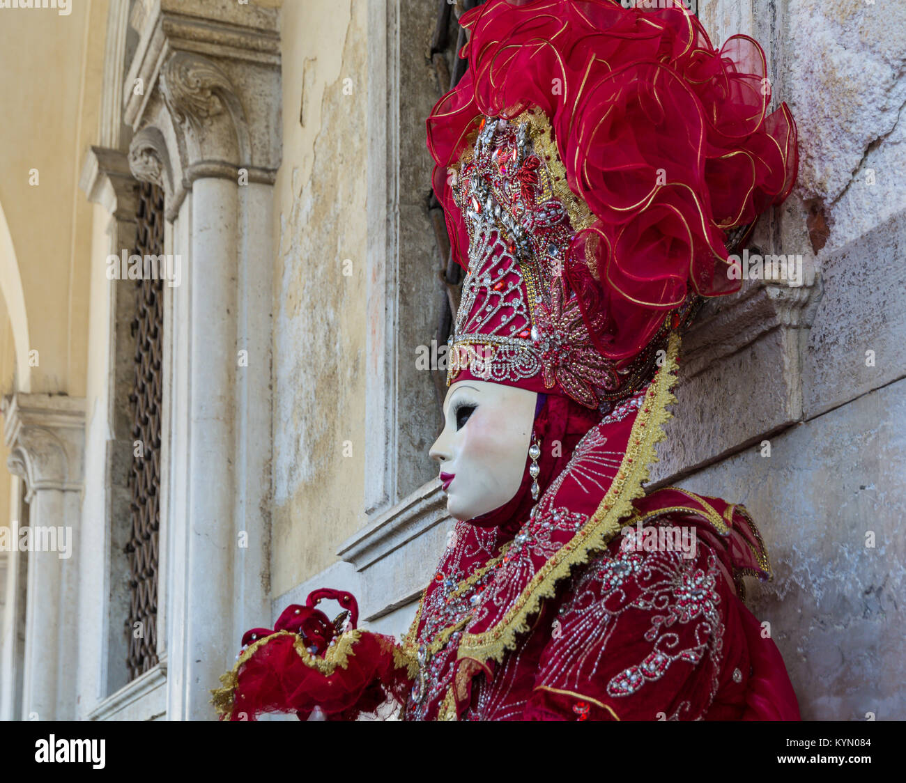 Beautiful red mask and costume at the Venice carnival Stock Photo - Alamy