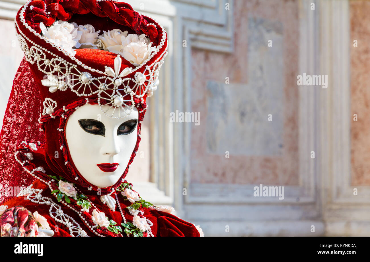 Beautiful red mask and costume at the Venice carnival Stock Photo - Alamy