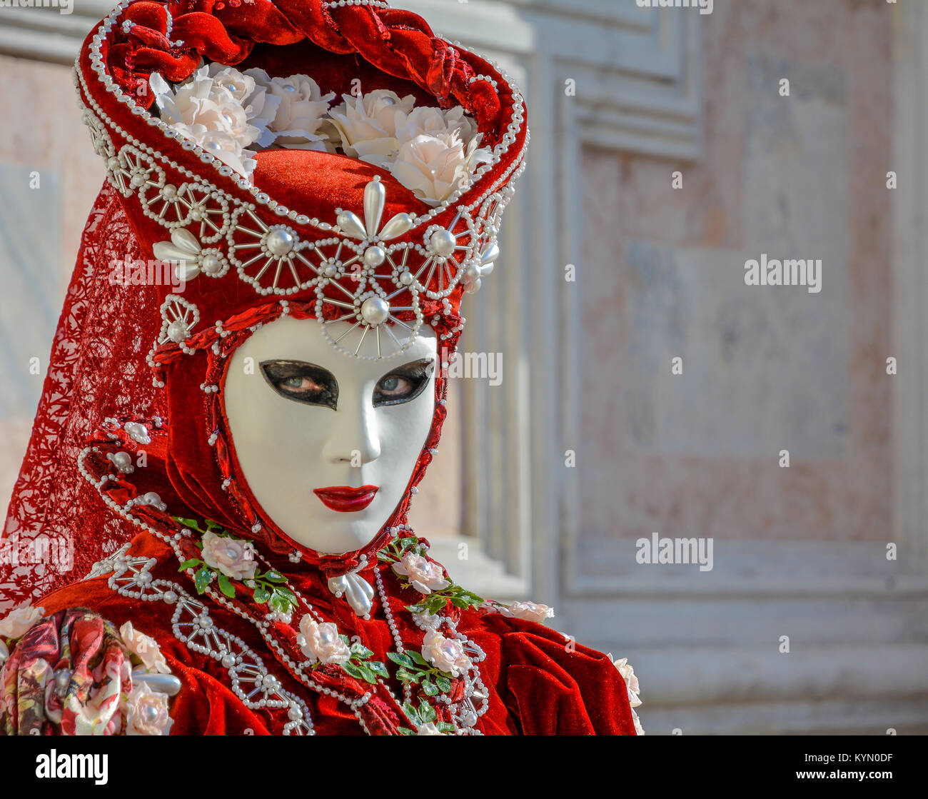 Beautiful red mask and costume at the Venice carnival Stock Photo - Alamy