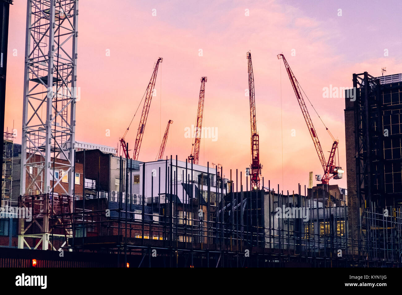 Evening cranes over a construction site near Oxford Street, London, UK Stock Photo