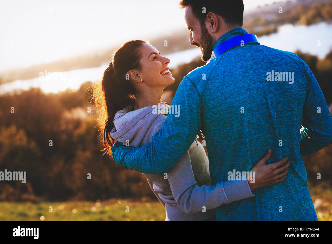 Happy young sporty couple sharing romantic moments Stock Photo - Alamy