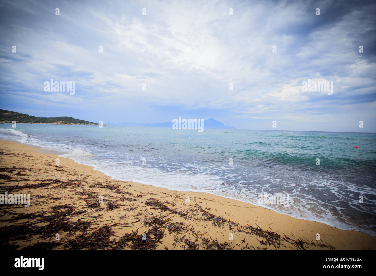 Rough sea , sand beach , dramatic sky Stock Photo - Alamy