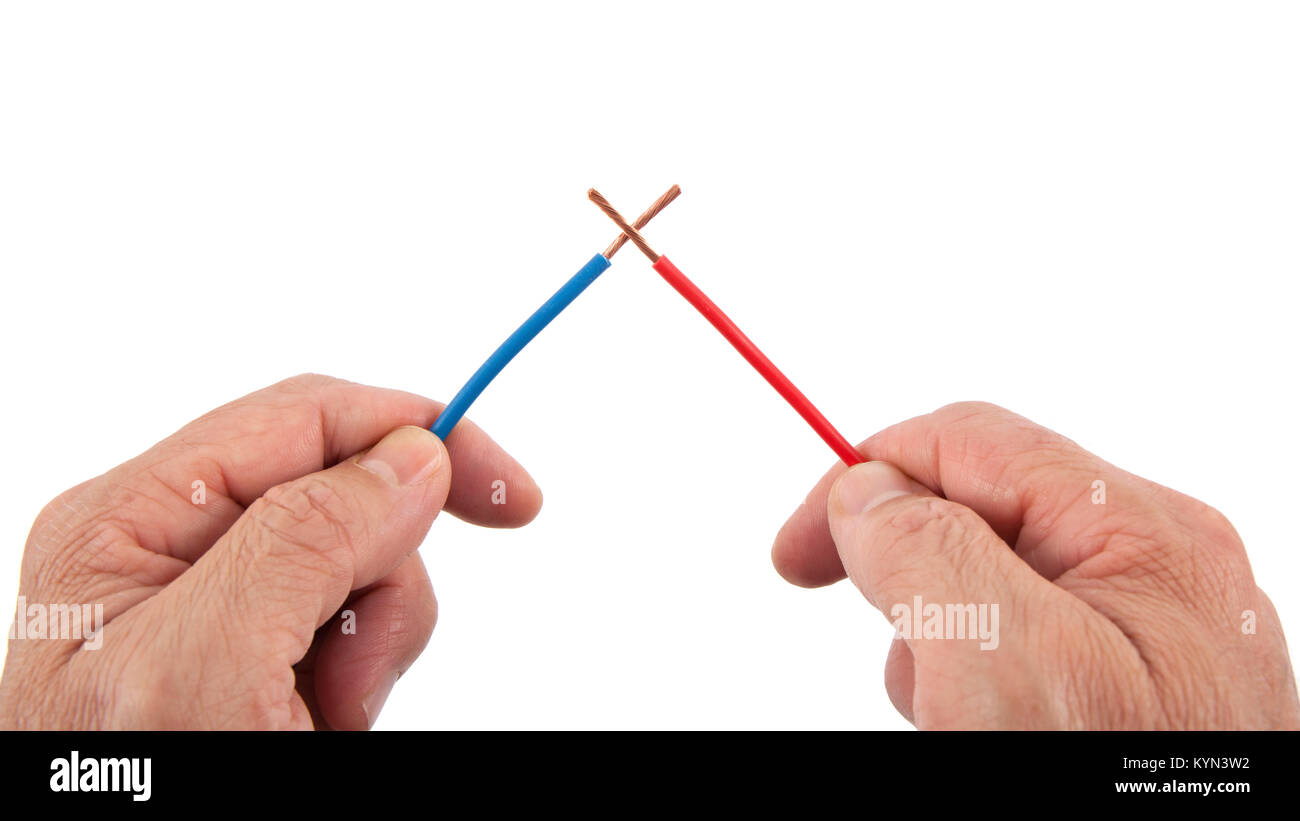 Red and blue crossed wires in position of short circuit in hands of repairman, electrician isolated on white Stock Photo