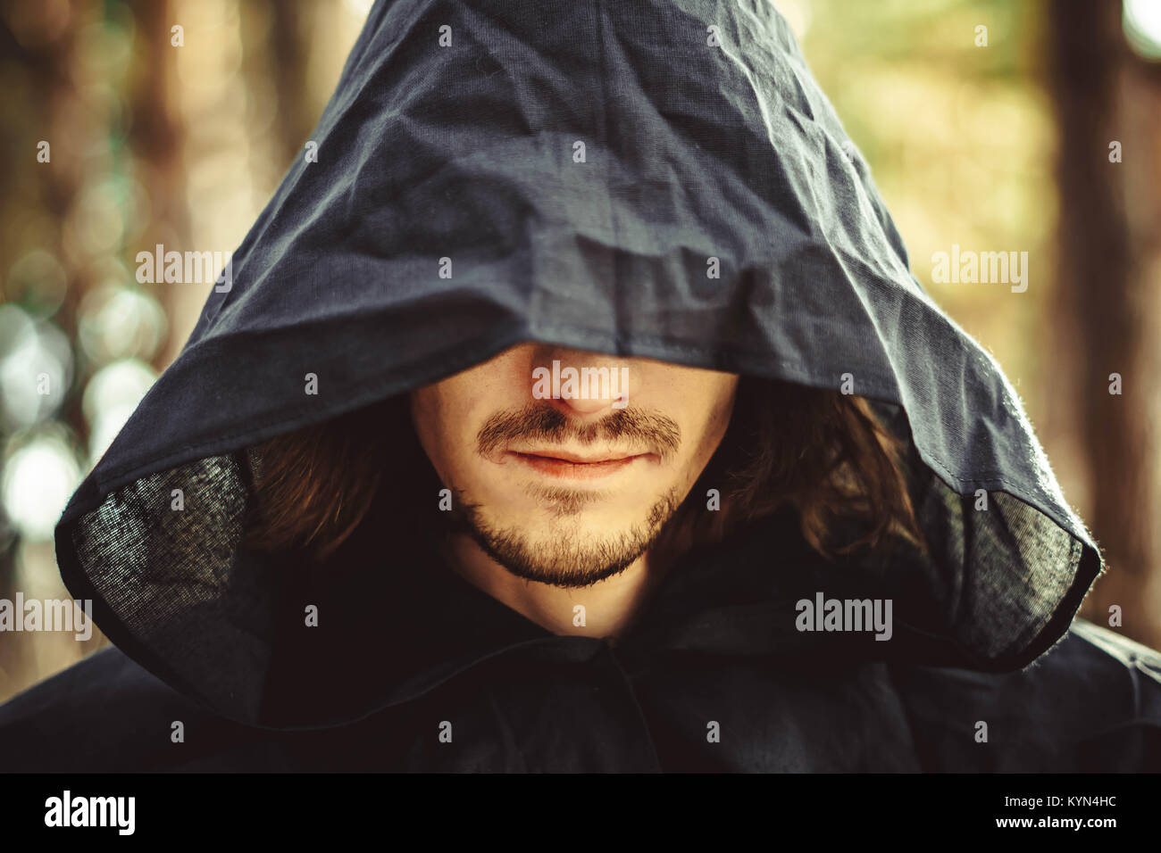 Man in black cloak with hood hi-res stock photography and images - Alamy