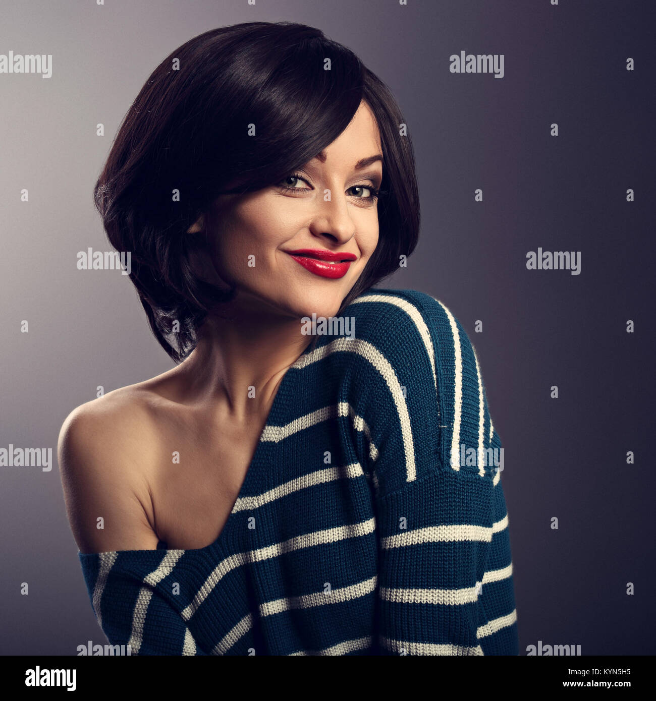 Happy Smiling Young Woman With Black Short Hair In Fashion Sweater