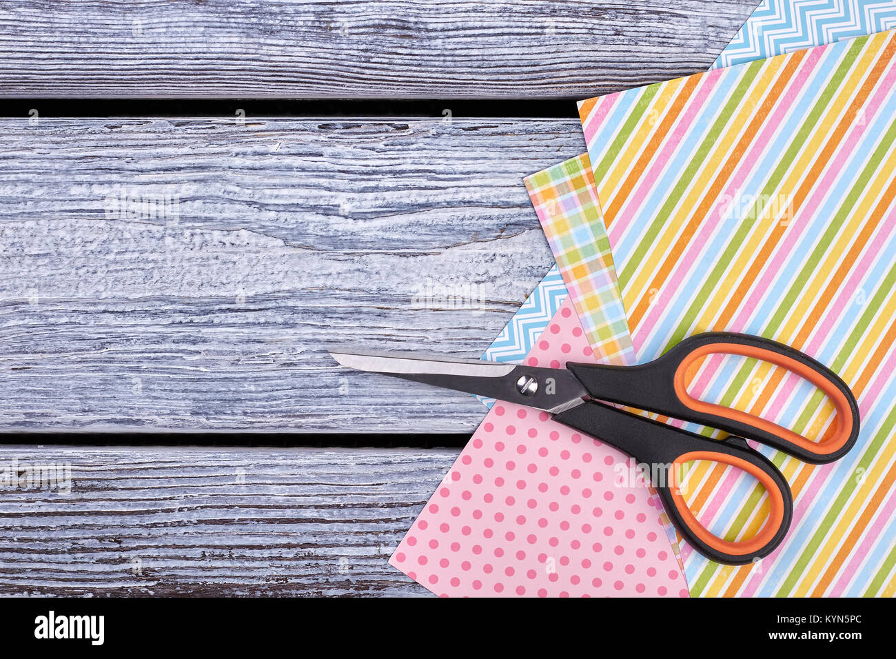 Patterned sheets of paper and scissors Stock Photo - Alamy