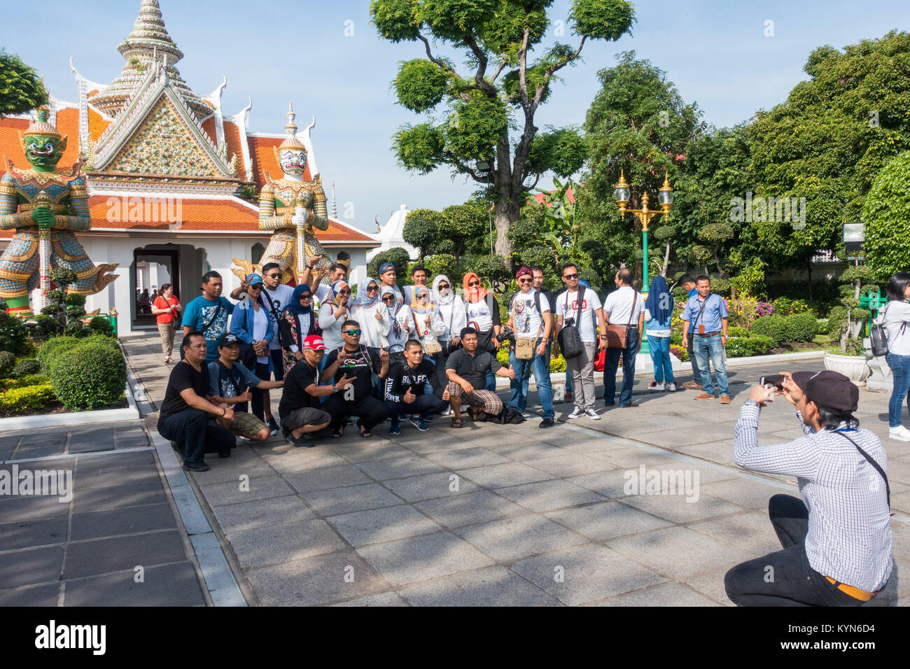Bangkok Thailand, tourist taking a group photo in Wat Arun temple complex. Stock Photo