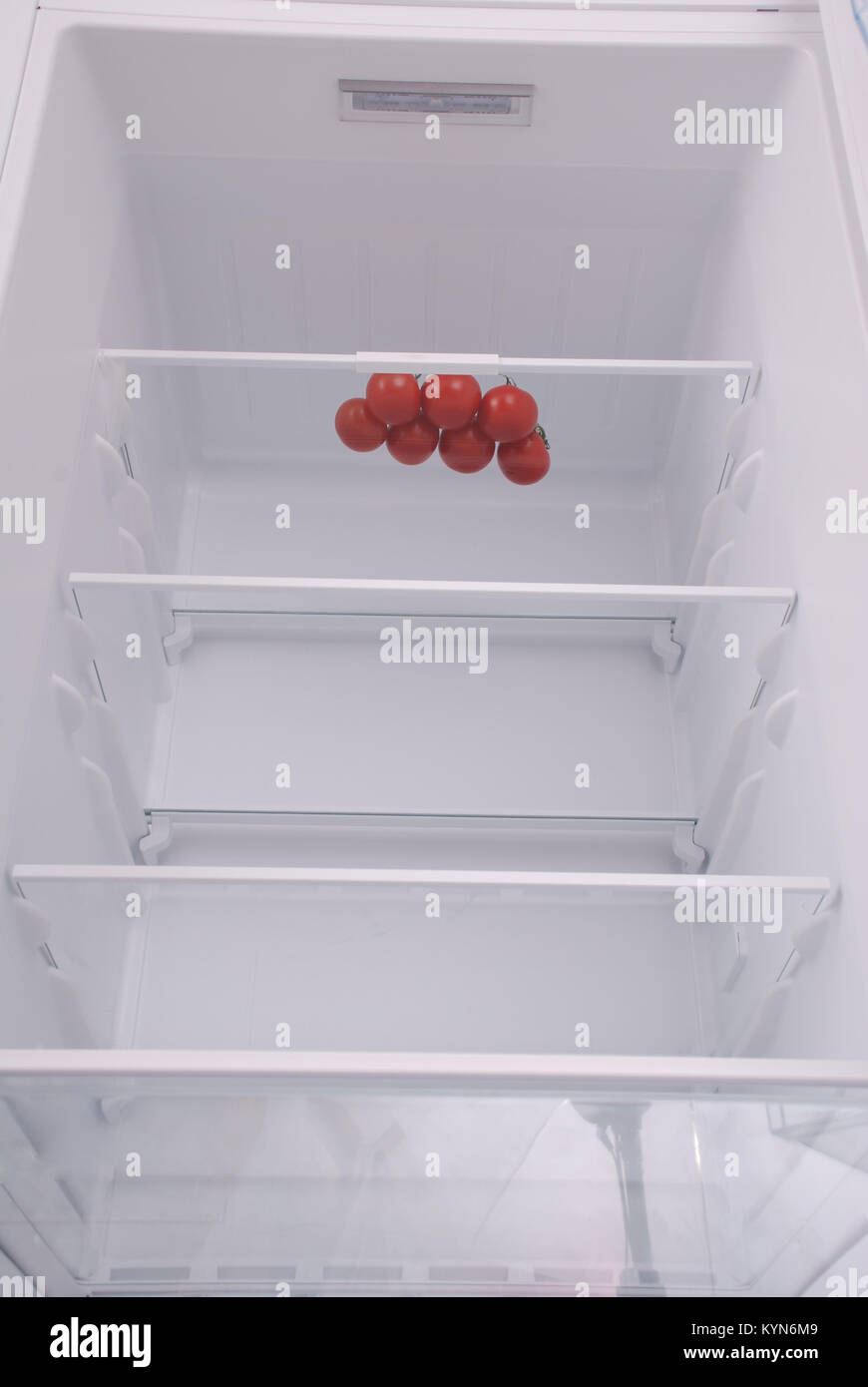 Cherry tomatoes in open empty refrigerator. Weight loss diet concept Stock Photo Alamy