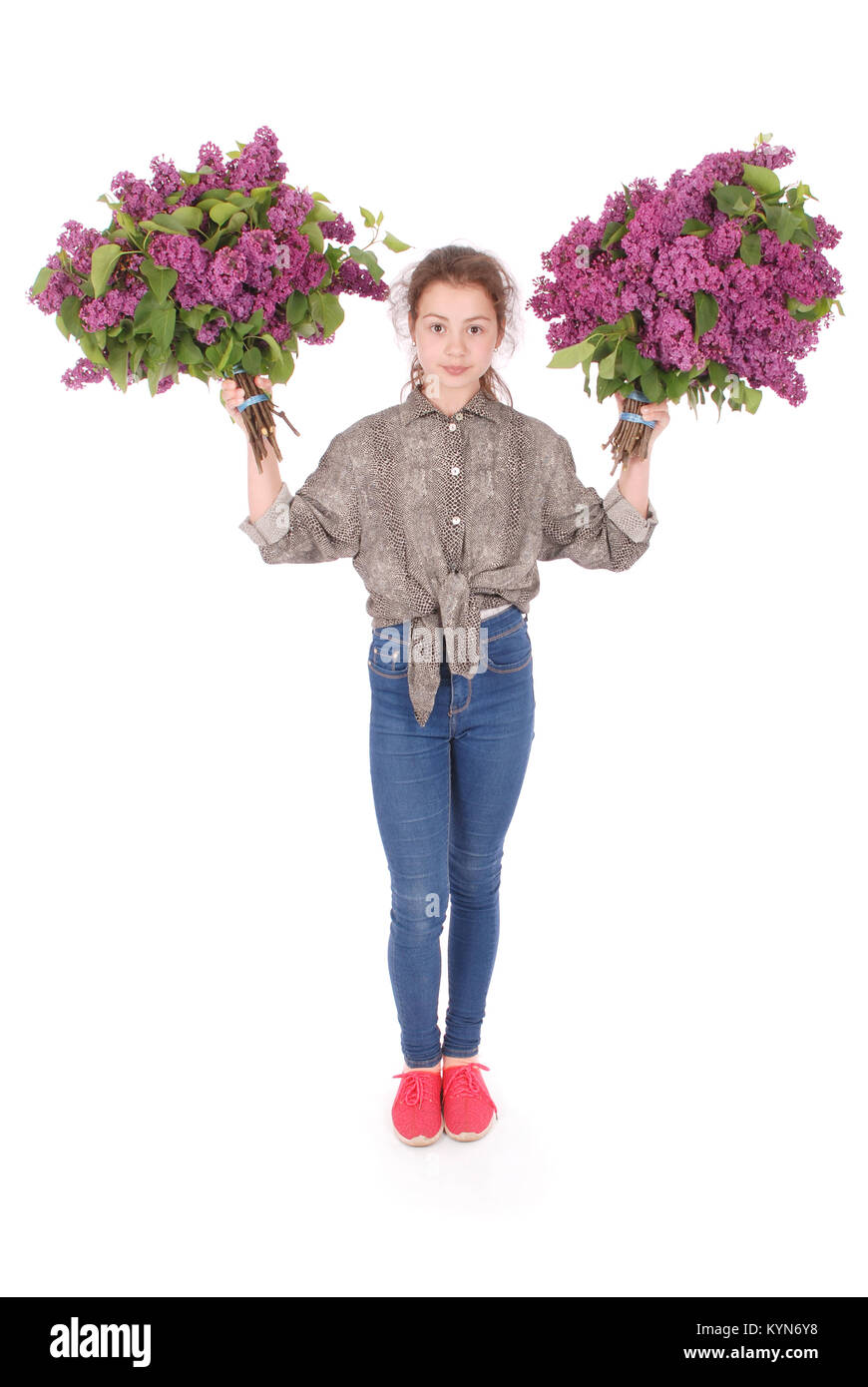 Teenage girl standing with lilac in both hands. Isolated on white ...