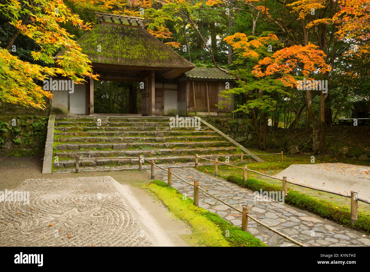 Fall color surrounds the gates of the Honen-In temple garden in Kyoto, Japan. Stock Photo