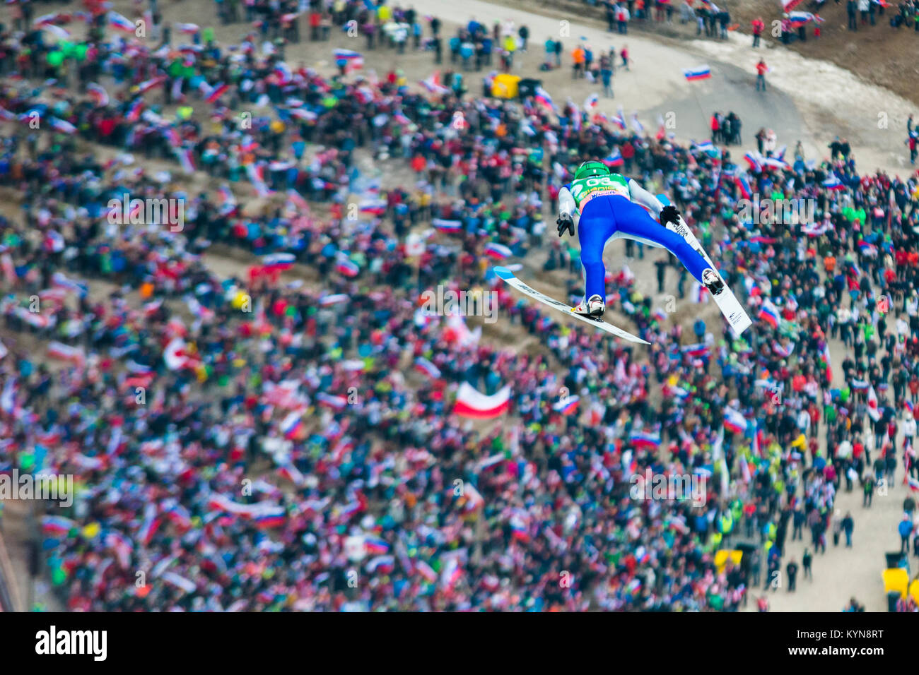 Flying skijumper Anže Lanišek above the crowd of supporters, Planica 2017, Slovenia, FIS Ski Jumping World Cup finals Stock Photo