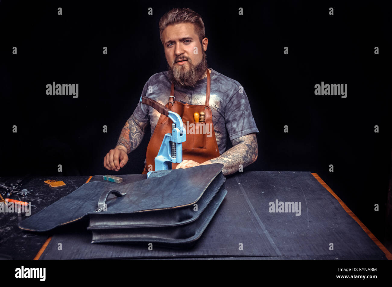 Skinner processing a leather workpiece Stock Photo Alamy