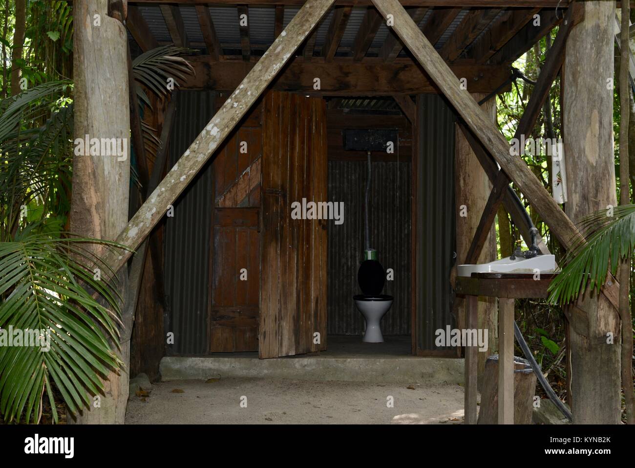 Toilet or outback dunny in an old style wooden building in a tropical rainforest, Finch Hatton