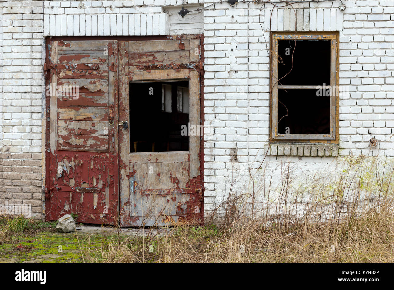 A wall with an old window and a door Stock Photo - Alamy