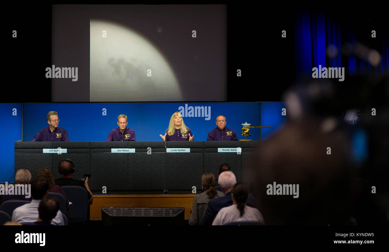 One of the final images of Saturn's moon Titan, that was taken by the Cassini spacecraft on Sept. 11, is seen as Cassini project scientist at JPL, Linda Spilker, second from right, speaks during a press conference previewing Cassini's End of Mission, Wednesday, Sept. 13, 2017 at NASA's Jet Propulsion Laboratory in Pasadena, California. Also participating in the press conference were director of NASA's Planetary Science Division, Jim Green, left, Cassini program manager at JPL, Earl Maize, second from left, and principle investigator for the Neutral Mass Spectrometer (INMS) at the Southwest Res Stock Photo