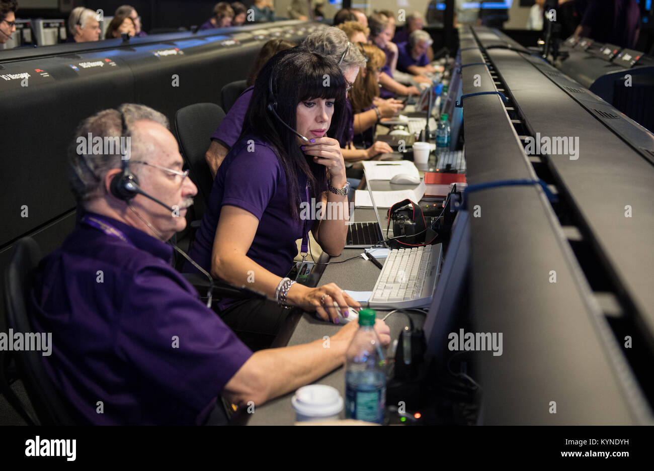 Aseel Anabtawi, of Cassini's radio science team, monitors her console in mission control during Cassini's final plunge into Saturn, Friday, Sept. 15, 2017 at NASA's Jet Propulsion Laboratory in Pasadena, California. Since its arrival in 2004, the Cassini-Huygens mission has been a discovery machine, revolutionizing our knowledge of the Saturn system and captivating us with data and images never before obtained with such detail and clarity. On Sept. 15, 2017, operators deliberately plunged the spacecraft into Saturn, as Cassini gathered science until the end. Loss of contact with the Cassini sp Stock Photo